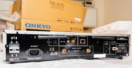 Foto de Paris, France - Dec 13, 2022: Rear view of connections of Onkyo NS-6170 network audio player with DSD Hi-Res Audio and DSD DAB WIFI device - Imagen libre de derechos