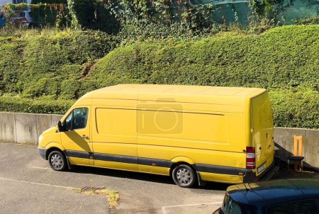 Photo for Germany - Sep 4, 2022: View from above of new yellow Mercedes-benz sprinter cargo van in a large parking of a warehouse - Royalty Free Image