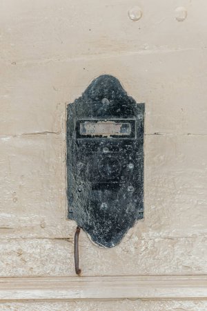 Photo for An old steel plate door in the Provence region of France, with weathered patina suggestive of its vintage charm. - Royalty Free Image