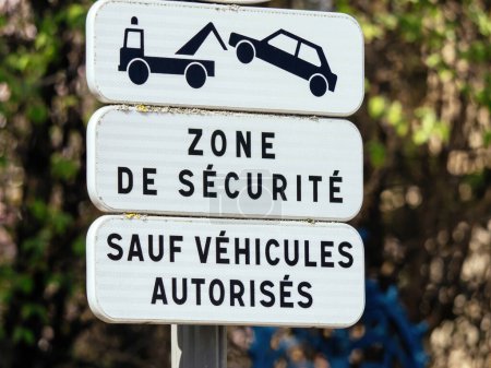Photo for A street sign in a French city, with text in western script providing guidance for only authorized vehicles to enter the security zone. - Royalty Free Image