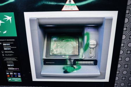 Photo for Strasbourg, France - Mar 22, 2023: Graffiti damaged display, keypad of the ATm of a BNP Paribas bank after a strike against pension reform Proposed by french President Emmanuel Macron - Royalty Free Image