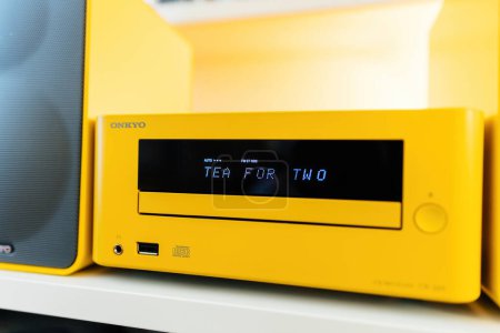 Photo for Paris, France - Feb 2, 2023: A modern Onkyo CD system is featured on sleek Vitsoe shelves in a luxurious living room. It boasts stylish yellow colors, features and superb sound quality - dot matrix - Royalty Free Image