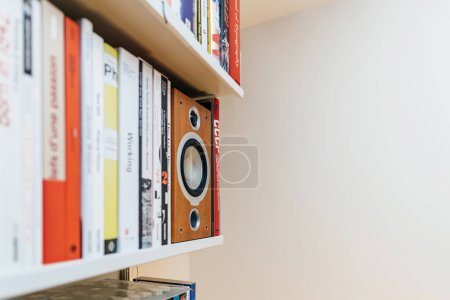 Photo for Paris, France - Jan 22, 2023: A spacious living room filled with luxury and order showcasing a large group of books neatly arranged on shelves, including a vitsoe 606 system and tannoy bookshelf - Royalty Free Image