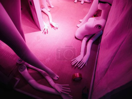 Photo for Damaged mannequins in a fashion store represent the fast fashion concept, featuring broken and disfigured models with magenta color tones. - Royalty Free Image