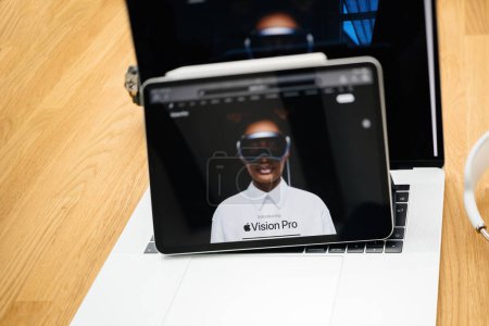 Photo for Paris, France - Jun 6, 2023: Tilt-shift lens over creative room table with webpage of Apple on iPad Pro XR showcasing Apple Vision Pro mixed reality XR headset. Priced 3,499 USD - future of computing - Royalty Free Image