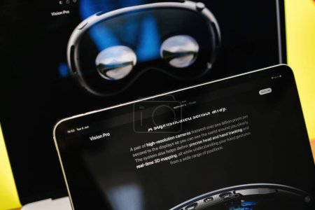 Photo for Paris, France - Jun 6, 2023: high-resolution camera features on the creative room table with webpage of Apple on iPad Pro showcasing Apple Vision Pro mixed reality XR headset. Priced 3,499 USD - - Royalty Free Image