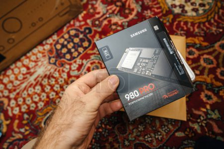 Photo for Frankfurt, Germany - Jun 15, 2023: Holding package of NVMe SSD unboxing reveals a Samsung 980 Pro computer disk drive. modern storage device. Perfect for highlighting the latest technology trends. - Royalty Free Image
