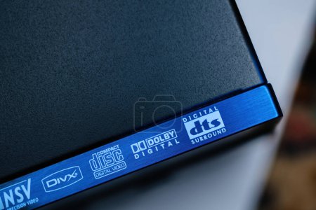 Photo for Hamburg, Germany - Feb 2, 2023: Close-up macro details of the steel surface of an Yamaha DVD SACD player with logotypes of DVIX, Compact Disk Digital Video, Dolby Digital and DTS surround - Royalty Free Image
