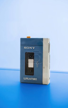 Photo for Schiltach, Germany - Jul 14, 2022: Contemporary image with sleek sony walkman cassette player electronic device on vibrant blue colored background. A symbol of retro style and obsolete technology. - Royalty Free Image