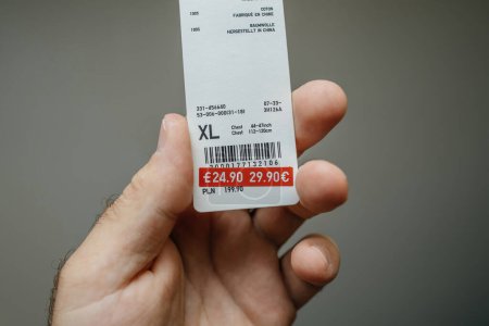 Photo for Paris, France - Jul 12, 2023: POV - A paper tag prominently displays a reduced price, marking down the item from 29.90 euros to a more enticing 24.90 euros. Made in China tag - Royalty Free Image
