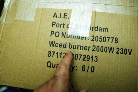 Photo for Paris, France- Apr 22, 2023: The Weed burner  text on a cardboard box is accentuated as a male finger purposefully points to it, emphasizing its relevance - Royalty Free Image