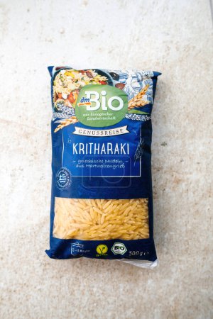 Photo for Frankfurt, Germany - Jun 3, 2023: A detailed close-up reveals a package of Kritharaki, traditional Greek pasta, marked as bio-organic and sourced from the German DM store. - Royalty Free Image