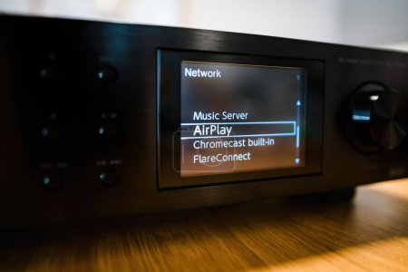Photo for Frankfurt, Germany - Jan 30, 2023: The digital display on the Pioneer NC-50DAB Network Streamer shows its diverse capabilities including Music Server, AirPlay, Chromecast Built-In, and FlareConnect - Royalty Free Image