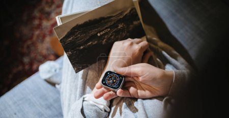 Photo for London, United Kingdom - Sep 20, 2023: a woman is in the process of unboxing the latest Apple Computers Watch Ultra 2, equipped with a new processor, an upgraded ultra-wideband chip, doubled storage - Royalty Free Image