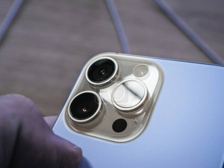 Photo for Paris, France - Sep 22, 2023: A detailed view of the iPhone 15 Pro Max, showcasing its 120mm lens made possible by tetraprisms for ultra-clear zoom in photos and videos - Royalty Free Image