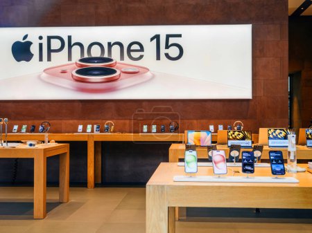 Photo for Paris, France - Sep 22, 2023: n empty Apple Store features a prominent in-store billboard, displaying large text for the iPhone 15 along with an image of its triple-camera system - Royalty Free Image