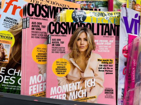 Photo for Frankfurt, Germany - Sep 17, 2022: Mass-media printed journalism: Cosmopolitan press featuring Jennifer Aniston in a light coat on the cover of a globally recognized magazine - Royalty Free Image