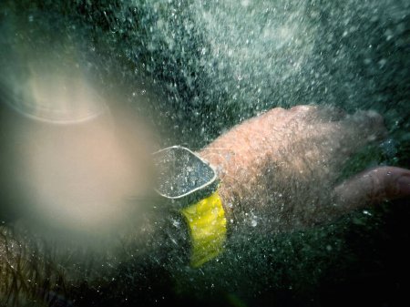 Photo for Paris, France - Sep 23, 2022: Male hand underwater diving swimming with new titanium Apple Watch Ultra designed for extreme activities like endurance sports, elite athletes, trailblazing, adventure - Royalty Free Image