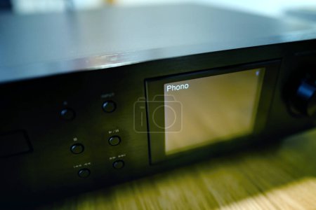 Photo for A close-up of the Phono inscription, indicating the connection port on a hi-fi music streaming device specifically designed for turntable integration, ensuring high-quality audio transfer - Royalty Free Image