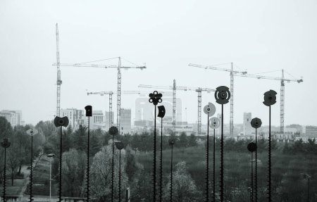 Photo for Paris, France - Dec 3, 2014: A monochrome scene captures towering construction cranes overseeing Paris, with the citys growing architectural forms stretching boldly in the foreground - Royalty Free Image