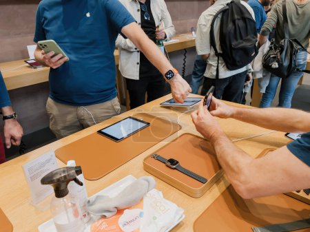 Photo for Paris, France - Sep 23, 2023: An Apple Store genius showcasing the new Apple Watch Ultra 2 on its first day of sale - Royalty Free Image