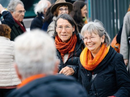 Photo for Strasbourg, France - Mar 29, 2023: Smiling Swiss senior women participate in a peaceful protest at the European Court for Human Rights, demanding climate change action - Royalty Free Image