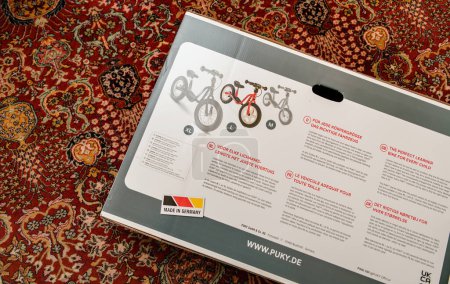 Photo for Munich, Germany - Apr 8, 2023: A new Puky learner bike sits on the carpeted floor in the living room, ready to be unboxed and assembled. This Made in Germany fun tool promises exciting adventures - Royalty Free Image