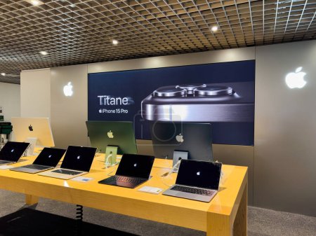 Photo for Strasbourg, France - Oct 3, 2023: Inside a FNAC electronics store in France, a captivating display advertises the new iPhone 15 Pro Titanium edition alongside a wide range of laptops and iMac - Royalty Free Image