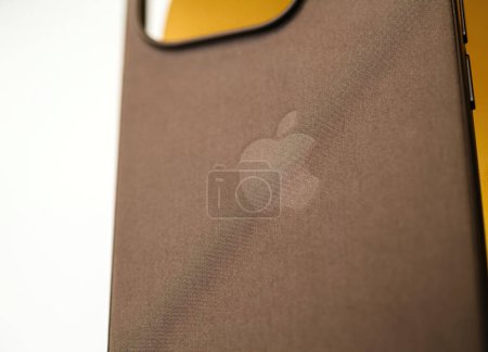 Photo for Paris, France - Oct 25, 2023: A focus on the Apple Computers logotype with a tilt-shift effect, situated on the new fine woven leather replacement case for enhanced visual appeal - Royalty Free Image