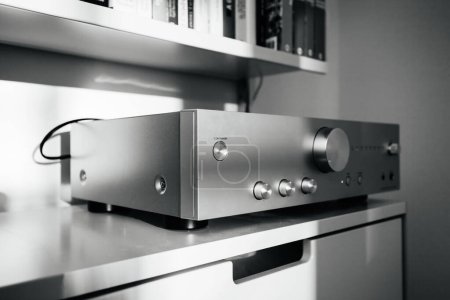Photo for Frankfurt, Germany - Dec 12, 2022: Black and white image of an Onkyo 9150 hi-fi amplifier on Vitsoe 606 shelves, highlighting the minimalist and functional design in a living room - Royalty Free Image