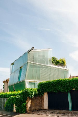 Photo for Thionville, France - Jun 10, 2016: Ultra-modern glass house in central Thionville, set against a clear blue sky, epitomizing contemporary design - Royalty Free Image