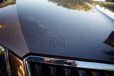 Photo for Detailed close-up of a cars hood showing scratches and scuffs, highlighting the need for auto body care and maintenance - Royalty Free Image