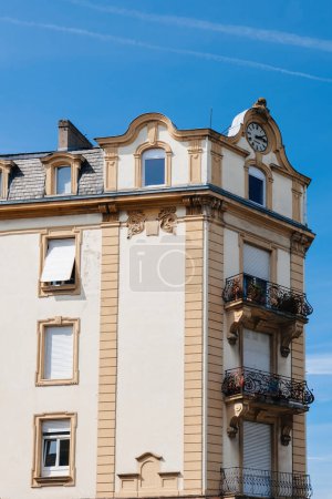 Photo for A magnificent real-estate investment reaching for the sky, adorned with an awe-inspiring clock at its pinnacle. - Royalty Free Image