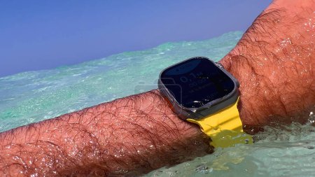 Photo for Mallorca, Spain - Aug 27, 2023: Diving into crystal-clear sea waters with the latest Apple Watch Ultra Series 2, combining style and performance for aquatic adventures - Royalty Free Image