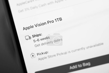 Photo for California, USA - Jan 21, 2024: A black and white image of the Apple iPhone 15 Pro displaying the delivery date for the Apple Vision Pro mixed reality headset developed by Apple Inc - Royalty Free Image