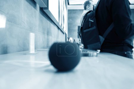 Photo for Paris, France - Oct 28, 2022: A defocused view inside an Apple Store showcasing the HomePod audio device with a smart assistant on the table. - Royalty Free Image