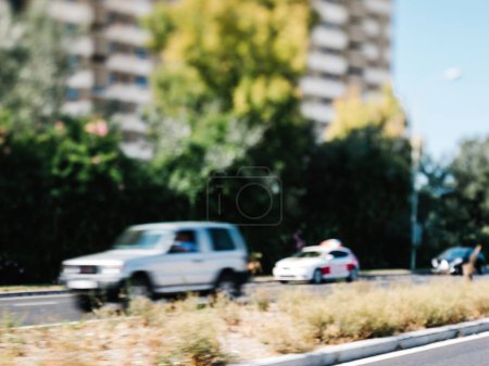 Photo for A defocused view of Av. de Gabriel Roca with multiple fast-moving cars captured through the optics of a tilt-shift lens - Royalty Free Image