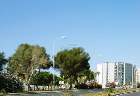 Photo for A mesmerizing perspective view from a moving car, capturing Av. de Gabriel Roca with miniature cars and a seaside apartment building in the background. - Royalty Free Image