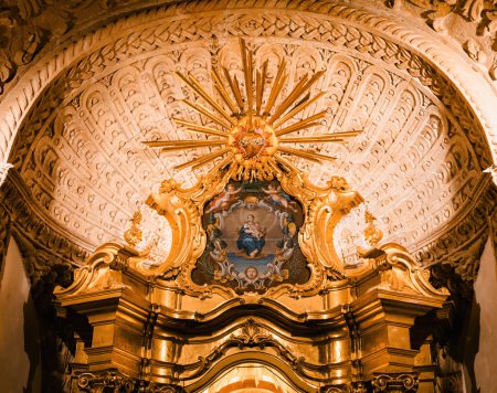 Photo for A captivating low-angle view of the altar at the Catedral-Basilica de Santa Maria de Mallorca, featuring an exquisite depiction of Saint Mary holding Baby Jesus - Royalty Free Image