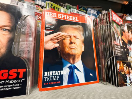 Photo for Berlin, Germany - Jan 25, 2024: The hero object from the latest Der Spiegel German magazine featuring a cover image of Donald Trump saluting with the headline Dictator Trump - Royalty Free Image