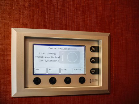 Photo for Germany - Jul 3, 2023: Busch-Jaeger Electro Home automation system control panel on wall with options for lighting and window shutters. - Royalty Free Image