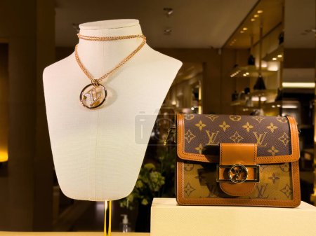 Photo for Strasbourg, France - Dec 25, 2023: A display in a store featuring a womans handbag and purse, showcasing their design and style - Luxury Louis Vuitton Store - Royalty Free Image
