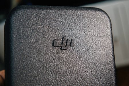 Photo for Lyon, France - Dec 27, 2023: Close-up of the DJI logo embossed on a textured surface of an electronic device - Royalty Free Image