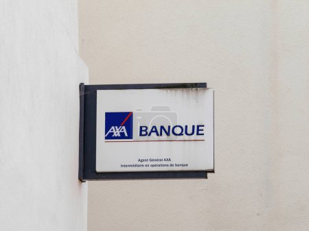 Photo for Haguenau, France - Mar 20, 2024: Axa banque on the side of a building, hinting at financial services - french city of Haguenau, France - Royalty Free Image
