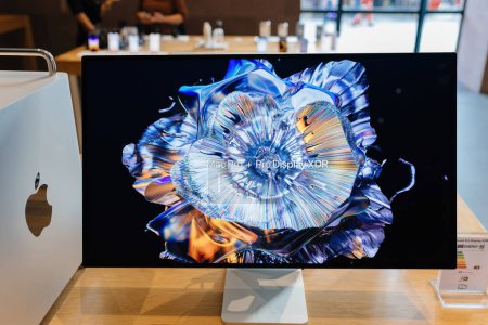 Photo for Paris, France - Oct 28, 2022: The Mac Pro and Pro Display XDR, featuring advanced silicon, multiple RAM and GPU options, are displayed on a table in an Apple Store, symbolizing powerful computing for - Royalty Free Image
