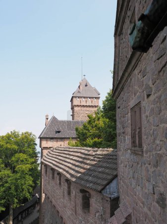 Walls of castle of Koenigsbourg in european Orschwiller town of Alsace in France, clear blue sky in 2018 warm sunny summer day on August - vertical