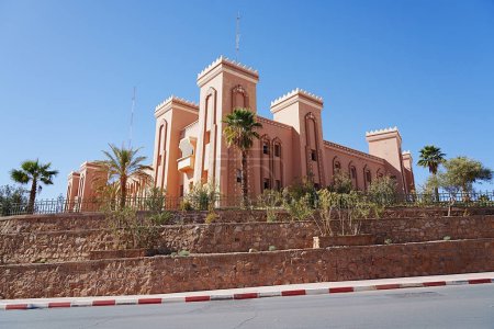 Side of provincial government in african Zagora town on Draa Tafilalet region in Morocco, clear blue sky in 2023 warm sunny winter day on January