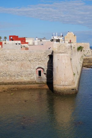 Seaside ramparts of african MAZAGAN city in Morocco, clear blue sky in 2023 warm sunny winter day on January - vertical