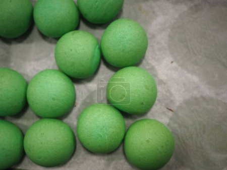 Photo for Baker chef making red violet yellow and green small 30 grams coloured buns for event finger food - catering preparation - Royalty Free Image