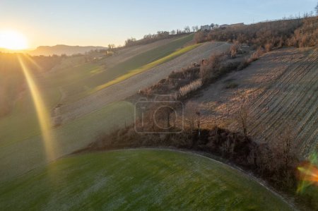 Photo for Aerial view of sunset time in hilly landscape in winter in Castell'Arquato area, Arda Valley, Piacenza Italy - Royalty Free Image